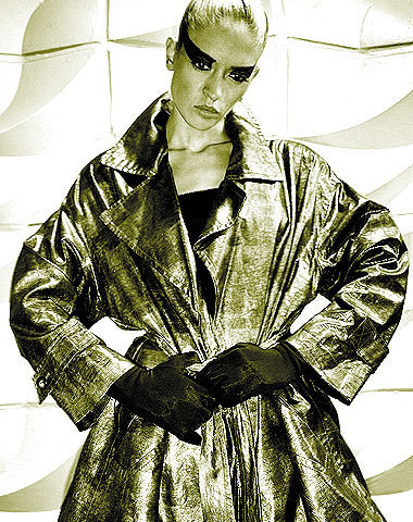 International fashion model Vera Gafron poses for top fashion photographers for the trend cataloge or lookbook by fashion designer Torsten Amft in a progressive trenchcoat
