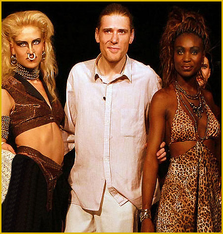 german model Vera Gafron and the african model Vivian with fashion designer Torsten Amft on the runway to final of the trend collection spring / summer 2008 - click here for back to the diary view