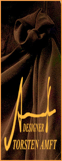 Detail view of the textile draping structure on a black wild silk summer dress designed by fashion designer Torsten Amft.