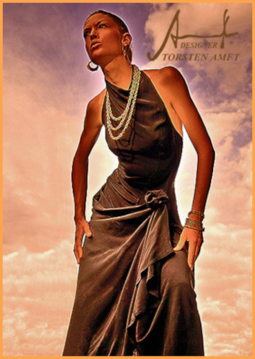 Vera Gafron wearing a black summer dress in wild silk with textile draping around the hip area, designed by Berlin fashion designer Torsten Amft.