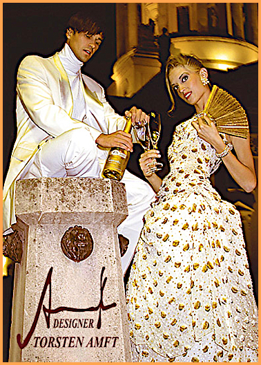 Model Vera weares a champagner colored chiffon gala robe with gold Lamè patterns and the dressman Marcel in a gala Tuxedo with cashmere turtleneck sweater manufactured by German fashion designer Torsten Amft from Berlin.